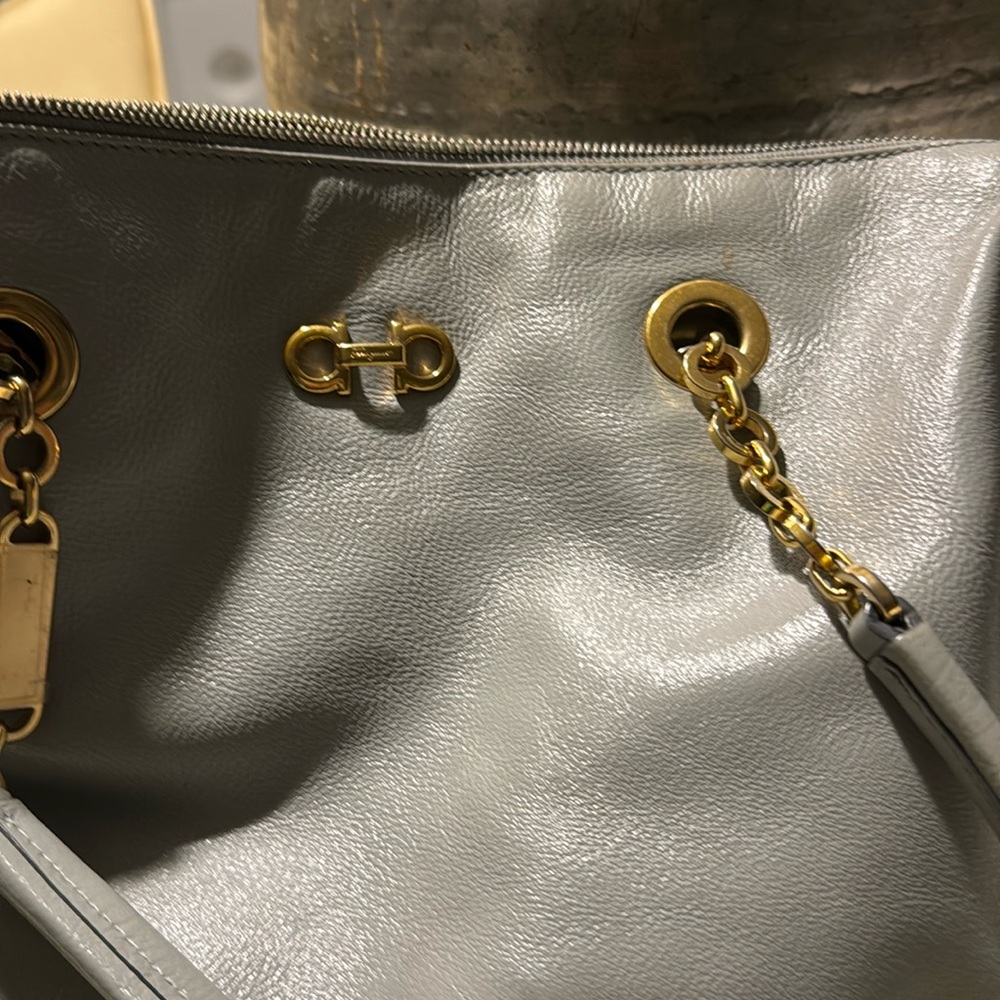 Salvatore Ferragamo women leath gray purse has rubbed spot as shown 16/9 inches